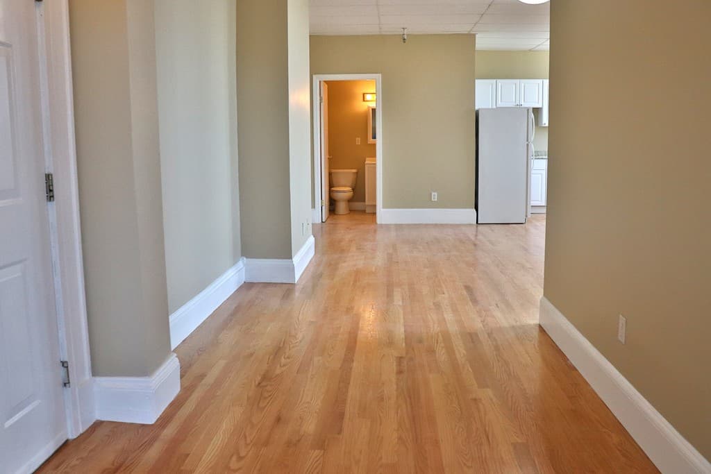 Interior hallway flow connecting bathroom and kitchen at 111 Lawrence Street #606