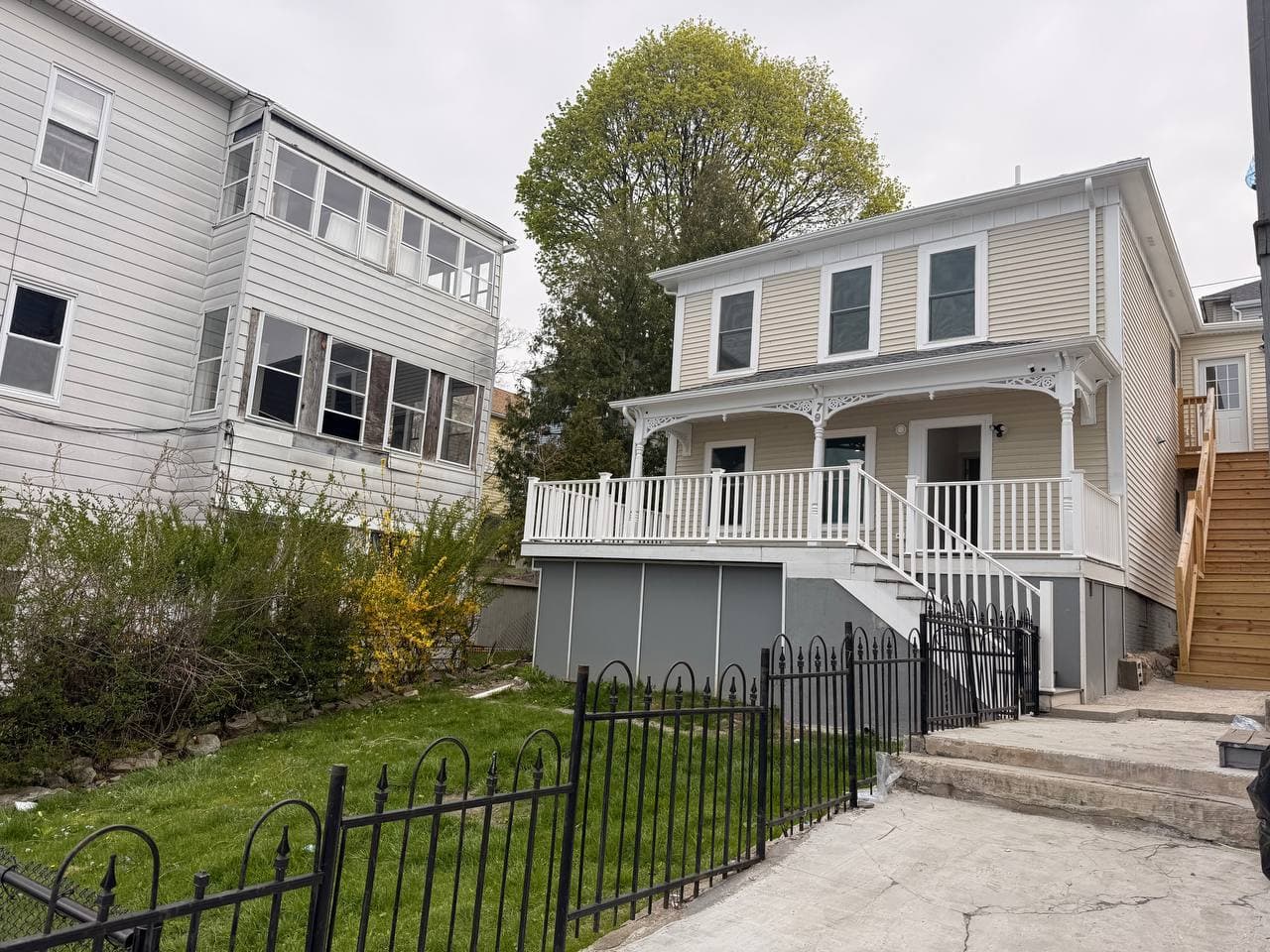 79 Fox Street Worcester MA renovated two-family with Victorian wraparound porch