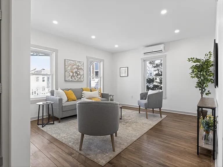 Bright living room with hardwood floors and mini-split AC at 79 Fox Street Worcester